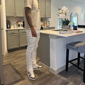 All white stacked jeans